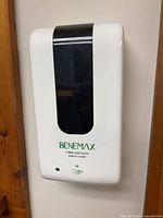 Front view of Benemax dispenser mounted on wall