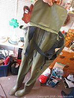 Photo showing green Vulcan hip waders with carrying case and straps.