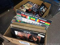Box of vinyl albums viewed from above showing Bob Marley & The Wailers album and others behind it.