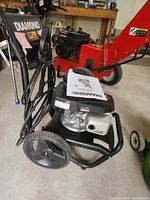 Front view showing Diamond branding, Honda engine, manual, hose, wand