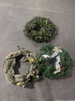 All three artificial wreaths grouped together