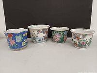 Front view of all four porcelain planters