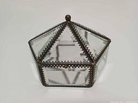 Overall view of hexagonal beveled glass and brass jewelry box showing shape and condition