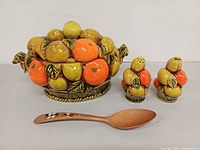 front view of soup tureen, salt & pepper shakers, and wooden spoon