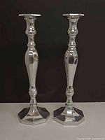 Front view of both candlesticks upright