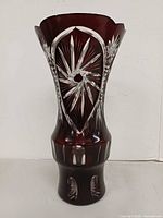 Front view of ruby red cut to clear crystal vase