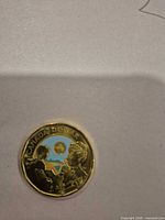 Reverse of 2024 Canadian $1 commemorative coin showing coloured enamel design