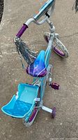 Top angle view displaying handlebars with streamers and Frozen graphics