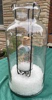 Full view of large outer jar with inner jar and artificial snow