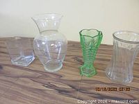 Four glass vases: cube, round, green pressed, ribbed cylindrical