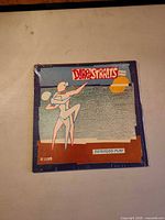 Front of album jacket showing artwork and title