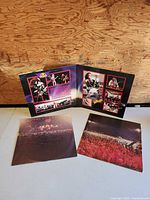 Gatefold jacket interior with photos, two printed inner sleeves laid out