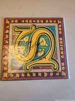 Front cover showing ornate letter S and album title