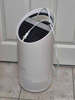 Front view of TruSens air purifier showing overall shape and power cord