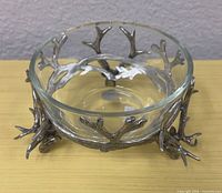 Overall view of glass bowl in antler stand