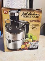 Retail box showing image and branding of Jack LaLanne Power Juicer Stainless Steel Edition