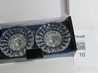 Open box showing two crystal candleholders