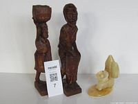 Overall lot: two wood statues and stone carving