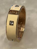 Full view of bracelet showing enamel band and rhinestones