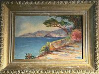 Front view of framed coastal painting
