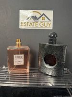 Front view of both perfume bottles together