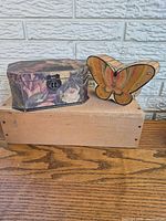 Both boxes front view atop wooden block
