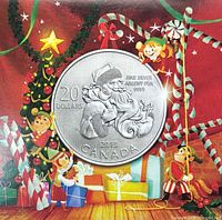 Obverse view of Santa Claus design $20 coin on folder