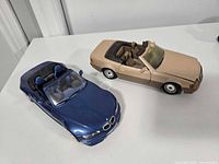 Top view of both convertibles showing colors and interiors