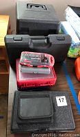 Full lot: multiple toolboxes, red organizers, waxer case and pouch on table