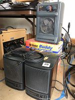 Photo showing two black FreshAir by Ecoquest air purifiers with wood grain sides, a gray Duracraft electric space heater on top of the Mr. Heater Portable Buddy box, cords visible on top