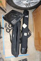 Photo showing Kodak Carousel 4400 slide projector, Tundra tripod and its carrying bag, Trek Pod tripod carrying bag