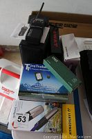 Overview of all items including radio, speaker, TPMS box, Gotenna box, CRKT box, SWAT flashlight box, phone and Leatherman box