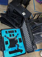 Open shot of the SKB hard shell case showing foam inserts cut for drone and GoPro gear