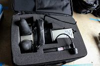 Foam-padded carrying case containing all components of the Saunders Cervical Hometrac homecare device including molded plastic parts and control unit.