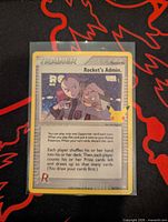 Front of Rocket's Admin trainer card in sleeve