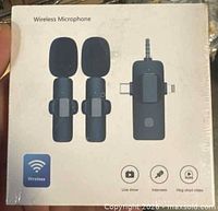 Shrink-wrapped retail box front showing two transmitters and 3-in-1 receiver