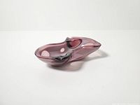 Angled side view showing overall biomorphic form and amethyst color