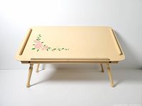 Full view of cream painted bed tray with legs extended