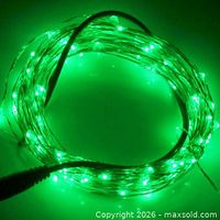Coiled green LED string light illuminated