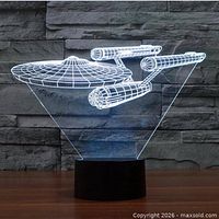 Lamp assembled and lit showing blue outline of USS Enterprise