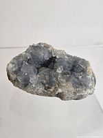 Front view showing sky-blue crystal cavity