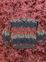 Full front view of sweater showing pattern and overall condition