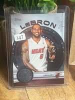 Front of 2012-13 Topps MVP LeBron James card in plastic sleeve