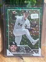 Front of sleeved Dylan Cease green refractor card