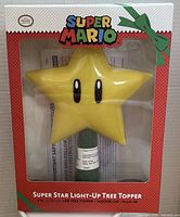 Front of retail package showing Super Star tree topper, branding and product details
