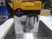 Boxed Keurig One-Touch Milk Frother showing the product image and branding