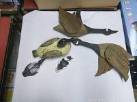 Lot of five duck-themed decorative items on white background