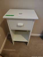 Full view of white wooden nightstand front and side