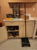 Overall lot showing cabinets, organizers, paint roller and tray