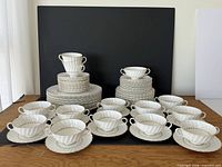 Entire dinnerware set with plates, bowls, cups, saucers displayed